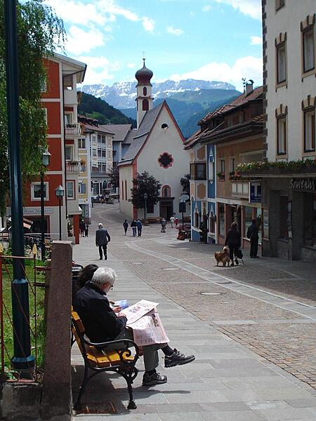 Street scene in Ortesei, the main town in the ski resort of Val Gardena in the Dolomites. In the center of the photo is St. Anthony's Chapel, built in 1673 on the main square.