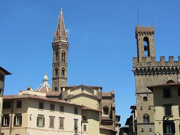 Church towers and the dome (in the far background) of the Duomo (Cathedral) in Florence.