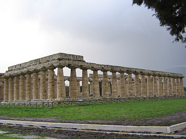 The First Greek Temple of Hera at Paestum in southern Italy. Paestum was a major ancient Greek city on the coast of the Tyrrhenian Sea in Magna Graecia (southern Italy). The ruins of Paestum are famous for their well-preserved ancient Greek temples - including two dedicated to Hera - dating from about 550 to 450 B.C.