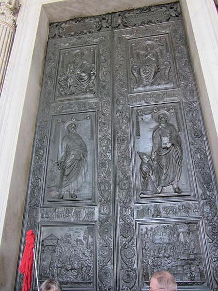 Decorated doors leading into Saint Peter's Basilica in Rome.