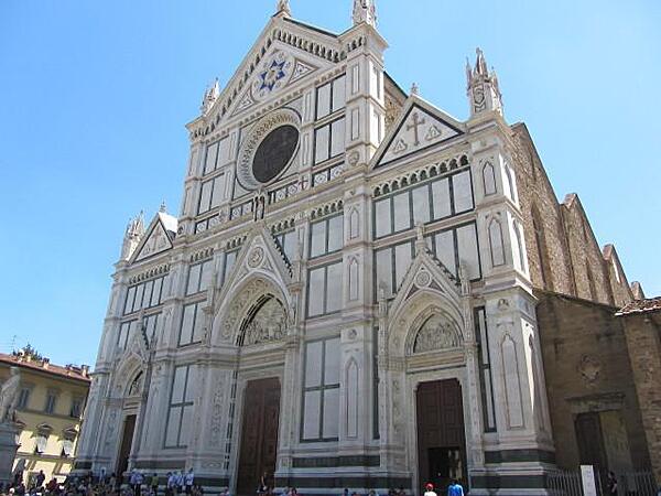The Basilica di Santa Croce (Basilica of the Holy Cross) in Florence is the largest Franciscan church in the world. Construction began in 1294 and consecration took place in 1442. Many of its 16 chapels are decorated with frescos by Giotto and his students. The basilica is the burial place of Galileo, Machiavelli, Michelangelo, and other famous Italian figures.
