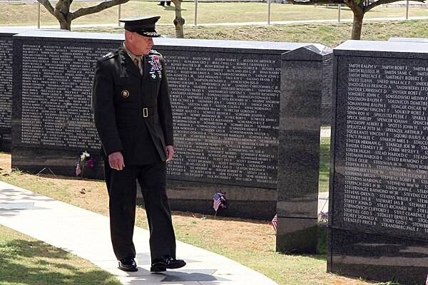 Lt. Gen. Kenneth J. Glueck Jr., commanding general of III Marine Expeditionary Force and commander of Marine Corps Bases Japan, reviews the names on the Cornerstone of Peace at Okinawa Peace Memorial Park in Itoman City, during the 2011 Okinawa Memorial Service for All War Dead June 23. Image courtesy of the US Marine Corps.