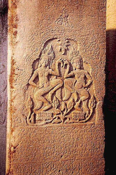 Carving at Banteay Srei, a 10th century red sandstone temple at Angkor that is much smaller than the other temple complexes in the region. Many of the exquisite carvings in this temple were stolen and sent to museums around the world. Today, some of these carvings have been replaced by cement replicas.