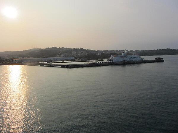 Sihanoukville, part of which is seen here at sunrise, is a major port in Cambodia and a growing beach resort. It was called Kampong Saom during the time of the Khmer Rouge. Construction on the port began in 1955 at the direction of King Norodom SIHANOUK after Vietnam began to restrict Cambodian access to ports in that country. The deep-water port, which opened in 1960, lies on the Gulf of Thailand about 185 km (115 mi) south of the capital at Phnom Penh.