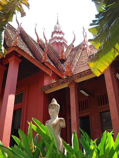 Entrace to the National Museum of Cambodia in Phnom Penh. Built between 1917 and 1924 to preserve Cambodia's cultural traditions, it houses the world's largest collections of Khmer art from prehistoric times through the Khmer Empire. It also displays an important collection of Buddhist and Hindu sculptures.