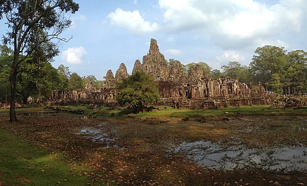 The Bayon is a richly decorated Khmer temple at Angkor best known for the multitude of serene and smiling stone faces on its many towers.