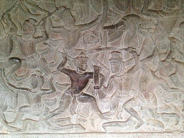 Wall carving showing a battle scene at Angkor Wat.