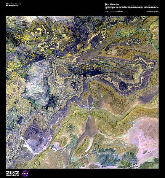 This enhanced satellite image shows the Anti-Atlas Mountains, part of the Atlas Mountain range in southern Morocco. The Anti-Atlas Mountains form a border between the Atlantic Ocean and the Sahara Desert, extending 500 km (310 mi) to their easternmost point, the 3,304 m (10,835 ft) peak of Djebel Sarho. The region contains some of the world's largest and most diverse mineral resources including phosphate rock, iron, zinc, copper, antimony, as well as gold and silver, most of which remain untouched. Image courtesy of USGS.