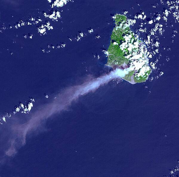 Eruptive activity of the Soufriere Hills Volcano on Montserrat is evidenced by an extensive smoke and ash plume streaming towards the west-southwest (image taken 29 October 2002). Significant eruptive activity began in 1995, forcing the authorities to evacuate about two-thirds of the island's original population of 12,000, and to close off the southern portion of the island. Image courtesy of NASA.