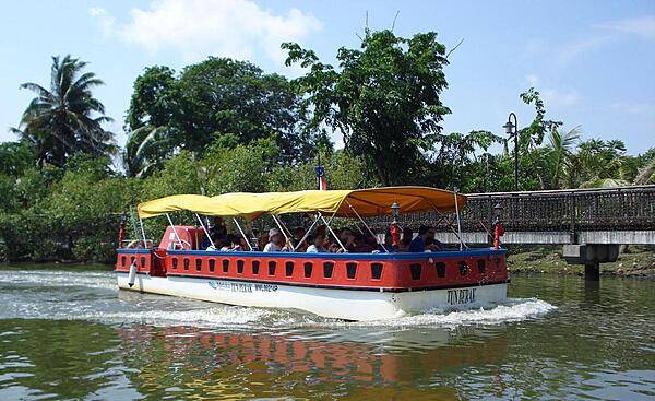 Sightseeing along one of the canals in Malacca Town, known as the Venice of the East.