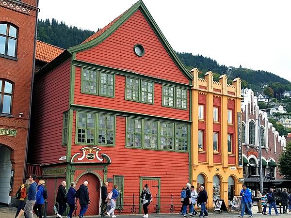 Brightly painted warehouses along the Hanseatic Wharf in Bryggen, the dock area of historic Bergen. Bryggen has been a UNESCO World Cultural Heritage site since 1979.