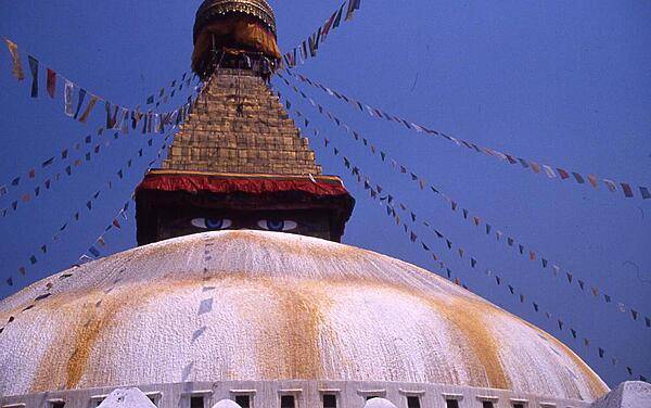 The eyes of Buddha gaze out over the dome of the Swayambhunath Stupa in Kathmandu.