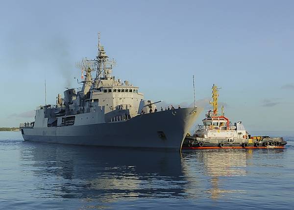 The New Zealand frigate HMNZS Te Mana (F111) makes a port call at Diego Garcia on 23 November 2013. The island's lagoon provides a sheltered anchorage where allied naval vessels can replenish. Diego Garcia provides critical logistical infrastructure support to US and Allied Forces forward deployed to the Indian Ocean and Arabian Gulf. Photo courtesy of US Navy/ Mass Communication Specialist Seaman Alex Smedegard.