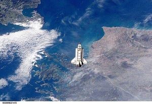 The Space Shuttle Endeavour approaches the International Space Station during rendezvous and docking operations. The spacecraft floats over Cook Strait, the body of water separating New Zealand's North Island (on the left) from South Island (to the right). Click on photo to increase resolution. Image courtesy of NASA.