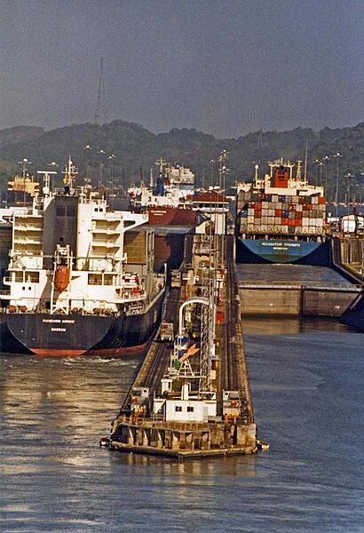 Container ships passing through locks in the Panama Canal.