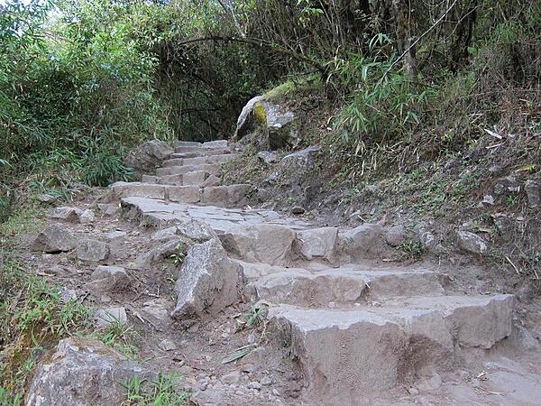 Steep rock steps on the Inca Trail are common. The majority of the trail's stones date back to the Inca Empire.