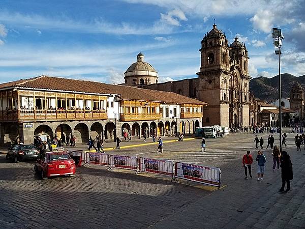 A colonial building and the Iglesia de la Compania de Jesus (Church of the Society of Jesus) on the Plaza de Armas (Parade Square) in Cusco.