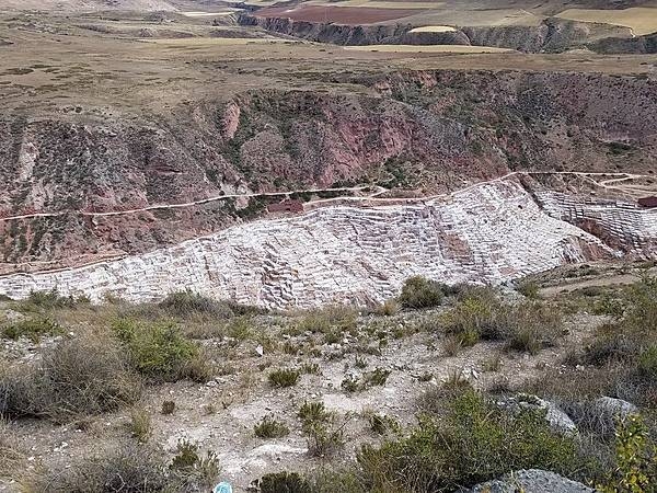 Salineras de Maras in the Sacred Valley is the site of ancient salt pans, first developed by the Wari culture and subsequently by the Inca. Today, there are more than 5,000 salt pans near Maras, almost all less than 4 sq m (43 sq ft) in size and no more than about 30 cm (1 ft) deep. Each pan is owned and mined by a local family of the Salineras community. The salt is collected and sold in local shops or in nearby towns.

Although the salt pans are man-made, the water that is channeled through them comes from a subterranean natural brine spring that bubbles up near the small town.