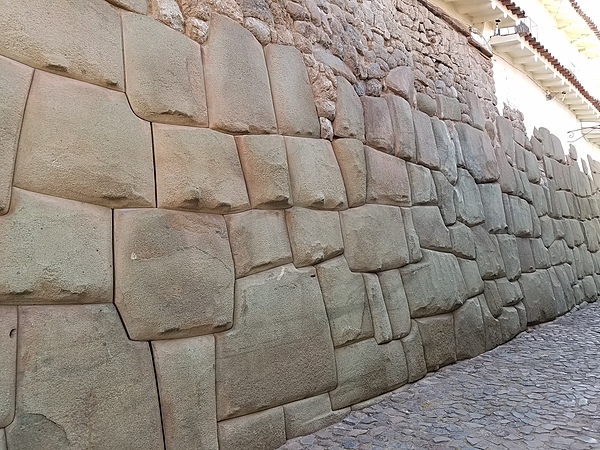 Close up of a typical Inca wall in Cusco - constructed without mortar and with no spaces between the enormous blocks of stone.