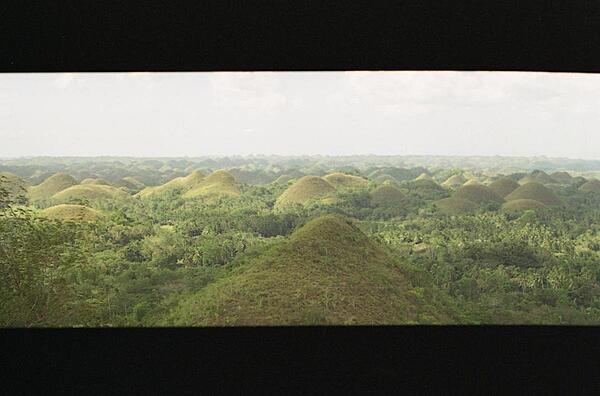 The unusual geological formation known as the Chocolate Hills in Bohol. Almost 1,300 perfectly cone-shaped hills, all about the same size, spread over some 50 square kilometers. The grass covering the hills turns brown during the dry season, giving the hills their name.