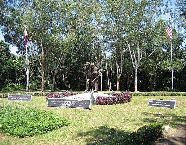The 3 m (10 ft) bronze sculpture entitled "Brothers in Arms" highlights the Filipino-American Friendship Park on the island of Corregidor. The park lies directly behind the Pacific War Memorial.