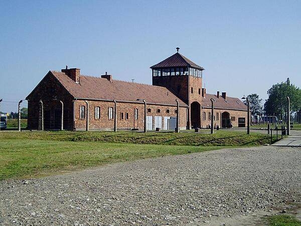 The infamous entrance building to the Auschwitz II (Birkenau) death camp in Oswiecim. The camp was built by Nazi Germany in occupied Poland during World War II. Over 1 million people died at this camp and surrounding satellite camps. The vast majority of the victims were Jews, but some Poles, Roma, and other Eastern European ethnic groups were also included. Following the war, the Polish Government decided to preserve part of the camp complex as a memorial museum.