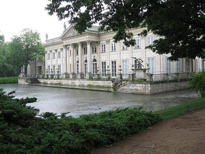 The north face (rear) of the Palac na Wodzie (Palace on the Water) located in the Park Lazienkowsi (Royal Baths Park) - the largest park in Warsaw. Built in the 17th century, the structure was remodeled in the 18th century and became a royal residence. The building is now a beautiful and harmonious mixture of architectural styles.