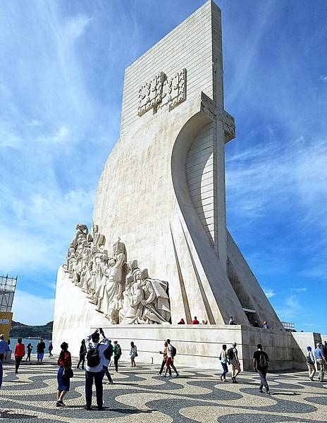The Padrao dos descobrimentos (Monument to the Discoveries) in Lisbon honors monarchs, explorers, navigators, cartographers, scientists, and missionaries from the Age of Discovery (15th and 16th centuries). The main statue of Henry the Navigator (1394-1460), holding a model of a carrack, leads a procession of 32 figures (16 on either side ramp) on the monument. This view is of the east side.