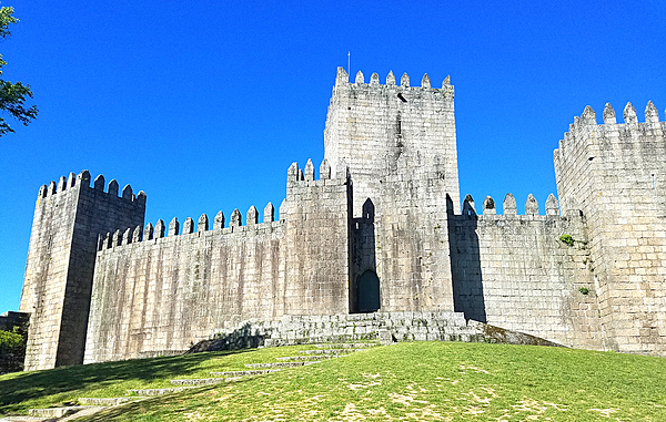The castle in Guimaraes was built in the 10th century to protect a nearby monastery from Moors and Norsemen. As the first capital of the nation and birthplace of its first king, Guimaraes it is one of Portugal's most historic cities and one of the most attractive places to visit in the country. Its historic town center is listed as a World Heritage Site in recognition of its being an "exceptionally well-preserved and authentic example of the evolution of a medieval settlement into a modern town" in Europe.