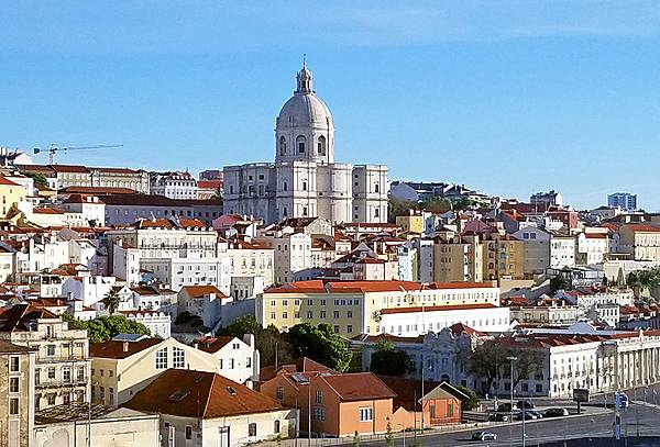 Lisbon, Portugal's capital and largest city, is often called the “White City."  The center of this scene shows the Church of Santa Engracia, a 17th-century monument.  Originally a church, it was converted in the 20th century into a National Pantheon in which important Portuguese personalities are buried.