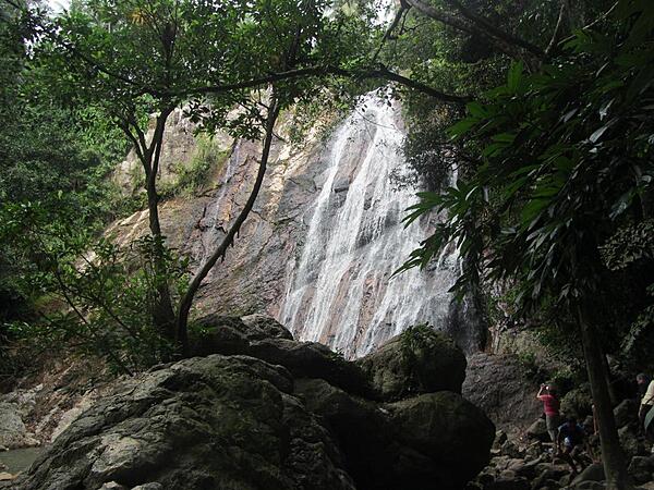 Na Muang Waterfall on Ko Samui. The water cascades some 30 meters (98 ft) down purple-hued rocks.