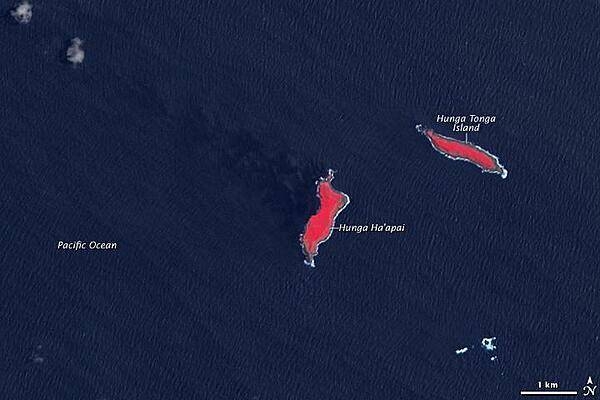 In this earlier satellite view of the islands of Hunga Tonga and Hunga Ha'apai from 14 November 2006, the healthy vegetation appears bright red and Hunga Ha'apai is significantly smaller in size than in the previous image. Photo courtesy of NASA.