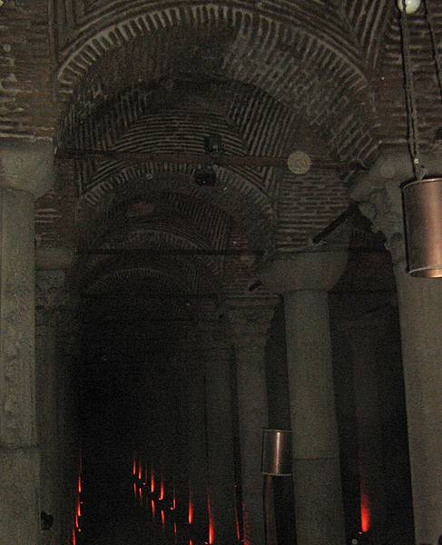 The Basilica Cistern is the largest of several hundred ancient cisterns that lie beneath the city of Istanbul; built in the 6th century A.D., it acquired its name from a great basilica that used to stand over the location. The cathedral-size cistern is an underground chamber approximately 138 m (453 ft) by 65 m (213 ft) capable of holding 80,000 cu m (2,800,000 cu ft) of water. The ceiling is supported by a forest of 336 marble columns, each 9 m (30 ft) high, arranged in 12 rows of 28 columns each spaced 5 m (16 ft) apart. The majority of the columns in the cistern appear to have been recycled from the ruins of older buildings from throughout the Byzantine Empire. They are carved and engraved out of various types of marble and granite.