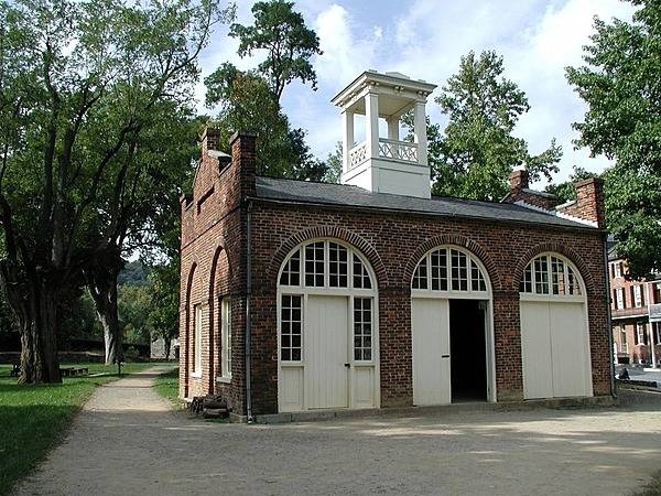 John Brown’s Fort at Harpers Ferry, West Virginia. The building was originally constructed in 1848 for use as a guard and fire engine house. The abolitionist John Brown and his small army captured the armory at Harpers Ferry on the night of 16 October 1859 and took 60 citizens of the town as hostage. The local militia and armed townspeople killed several of the insurrectionists and forced the remainder to take up a position inside the fire engine house. US marines battered down the door and stormed the fire house on the morning of the 18th, capturing Brown and killing several more of his men, while suffering one fatality and freeing all the hostages. Photo courtesy of the National Park Service.