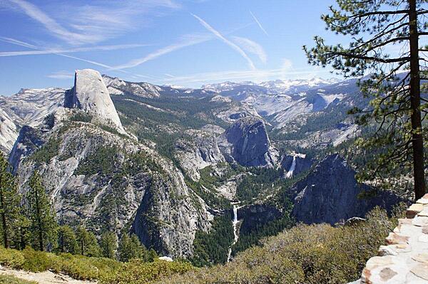 On the road to Glacier Point in Yosemite National Park one turns a corner and comes to a parking lot for Washburn Point. This view from the  Point shows Half Dome (far left), Nevada Falls (on the right), Vernal Falls (below center).