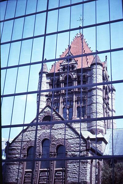 Trinity Church on Copley Square in Boston, Massachusetts lies literally within the shadow of the John Hancock Tower (New England's tallest). The church's reflection within the office building's windows creates an interesting juxtaposition of architectural styles.