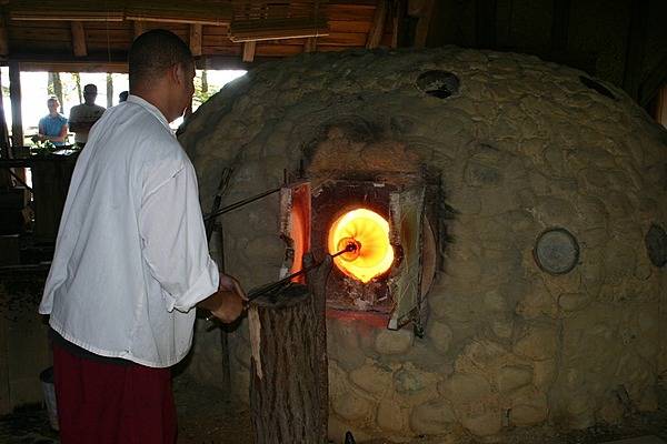 Glass making demonstration at Jamestown National Historic Site, Virginia where costumed interpreters demonstrate glass making techniques from the 17th century. Photo courtesy of the National Park Service.