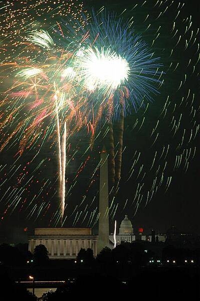 Fourth of July fireworks in Washington, DC; view of the Lincoln Memorial, the Washington Monument, and the US Capitol.