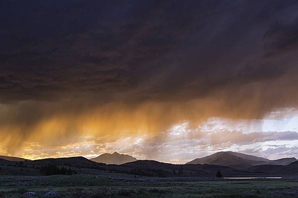A thunderstorm at sunset at Swan Lake Flat in Yellowstone National Park. Image courtesy of the US National Park Service/Neal Herbert.