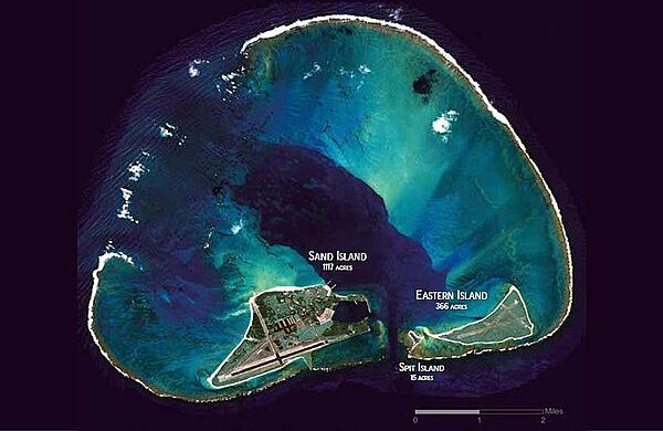 Midway Atoll is a 6.2 sq km (2.4 sq mi) atoll in the North Pacific Ocean. As its name suggests, Midway is roughly equidistant between North America and Asia, and lies almost halfway around the world from Greenwich, England. It is near the northwestern end of the Hawaiian archipelago, about one-third of the way from Honolulu, Hawaii to Tokyo, Japan. Photo courtesy of NASA.