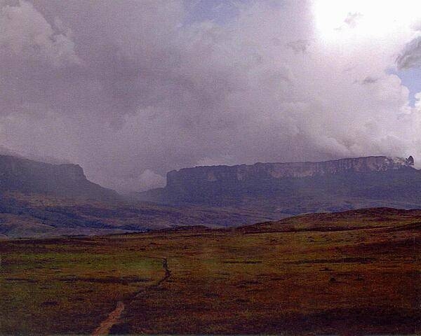 Mount Roraima on the right is the world's highest tepui (tabletop mountain), its peak is 2,835 meters; on the left is Kukeras Tepui.