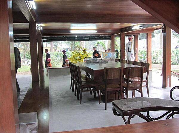 Meeting room in the outdoor office used by Ho Chi Minh on display in the Presidential Palace area near Ba Dinh Square in Hanoi. The soldier on the right is a member of the National Guard Force, which was founded by Ho Chi Minh in 1953.