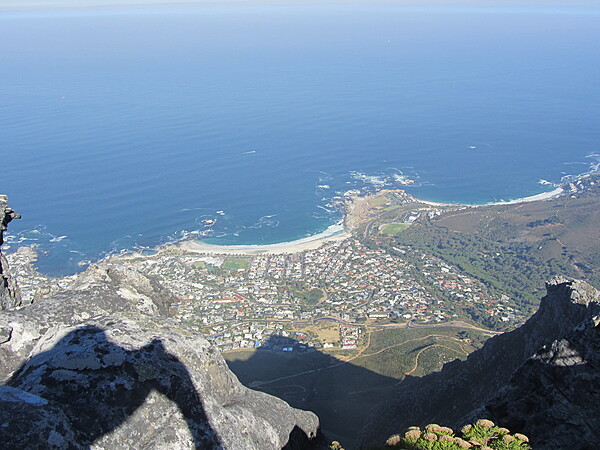 Cape Town from the top of Table Mountain with view of the ocean.